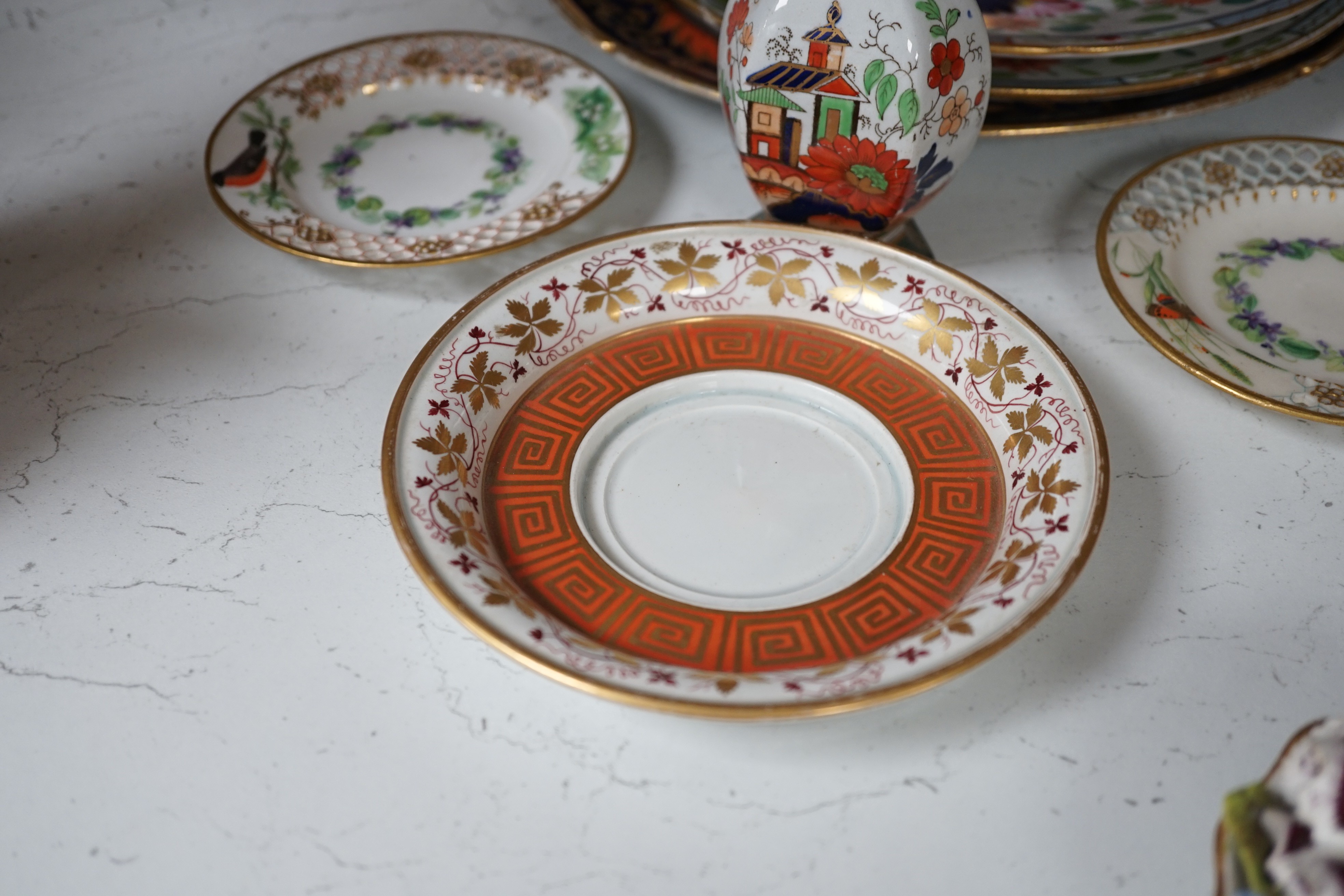 A selection of English porcelain and ceramics, to include a two handled Wedgwood Queensware urn, cover and stand, c.1800, two 19th century Worcester pierced bordered dishes, etc.